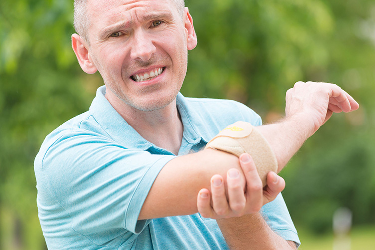 Man with elbow brace